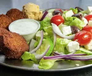 Falafel balls, romaine lettuce, onions, cucumbers, tomatoes, feta cheese and olives at Cafe Mediterano.